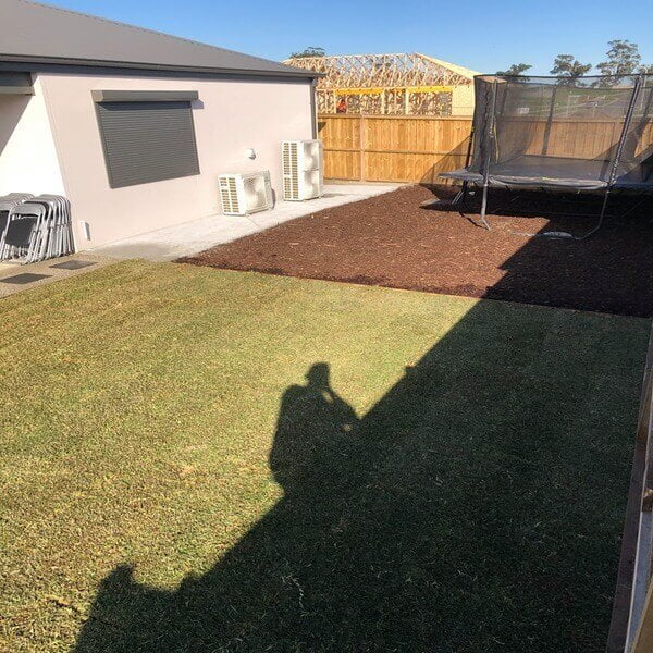 An after photo of a natural turfing and tanbark job in a Drouin backyard.